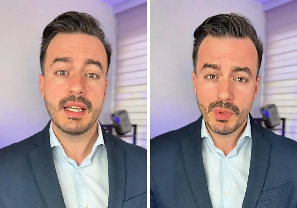 Hombre con traje azul, camisa clara, hablando. Podría estar desmintiendo mentiras en la carta de despido.